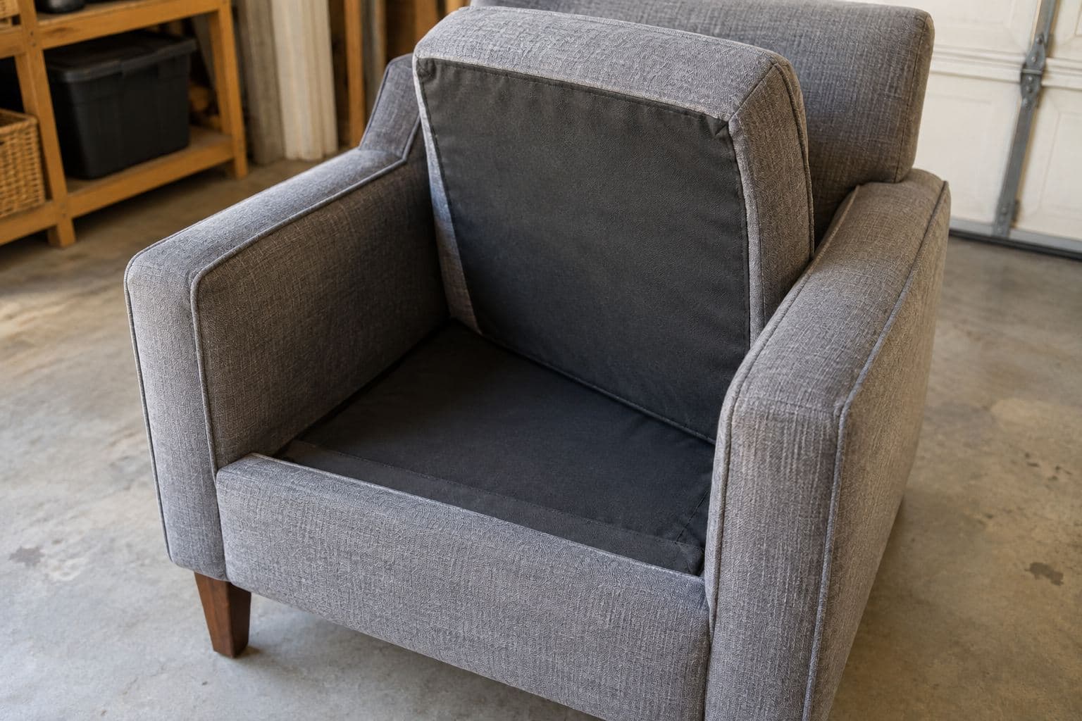Plain upholstered chair with a lifted seat cushion and visible fabric seams